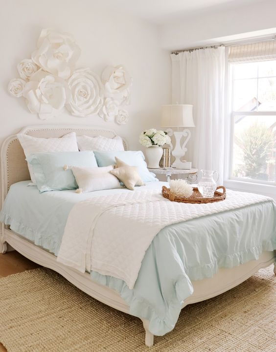 transform your bedroom with light blue color bed with flower decor on wall 